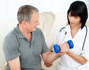 nurse helping a man with his exercise